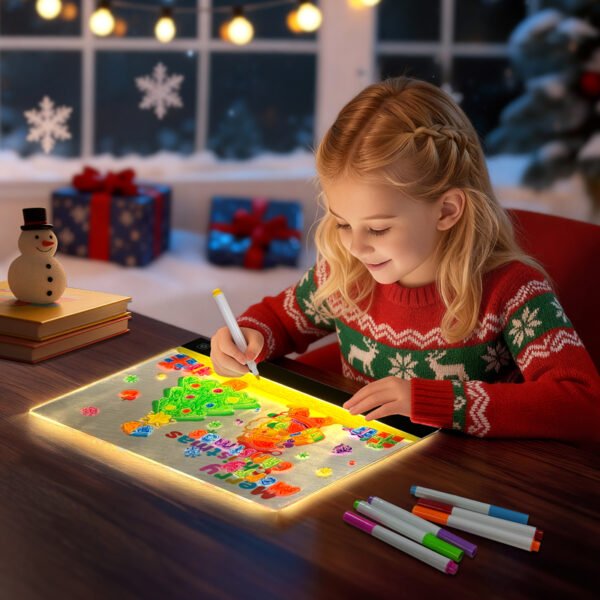 Girl using Christmas LuxeGlow drawing light